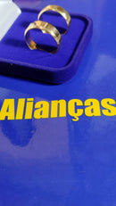 Alianças Ouro 18 kilates Peso 9 .10  Gramas 7 mm Lisa Blilhosa