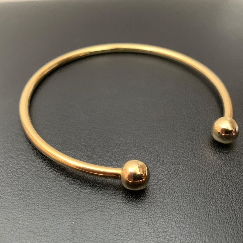 Bracelete Maciço Ouro18 kilates 15 Gramas 6 mm resistente Modelo Polido sem fecho e bolas 10 mm